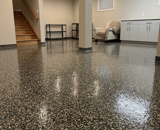 dark flake epoxy basement floor with staircase